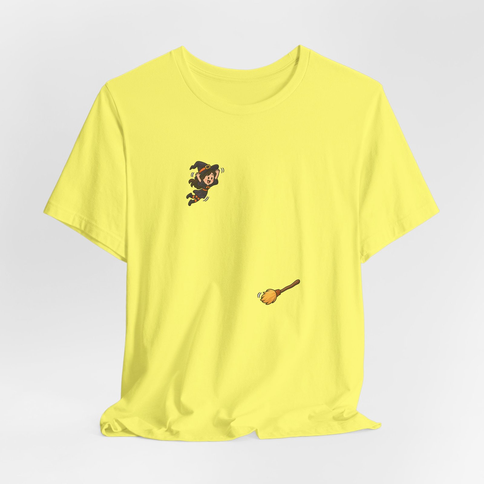 Playful Halloween Witch Jumping Onto Broom Graphic Tee - Image 12