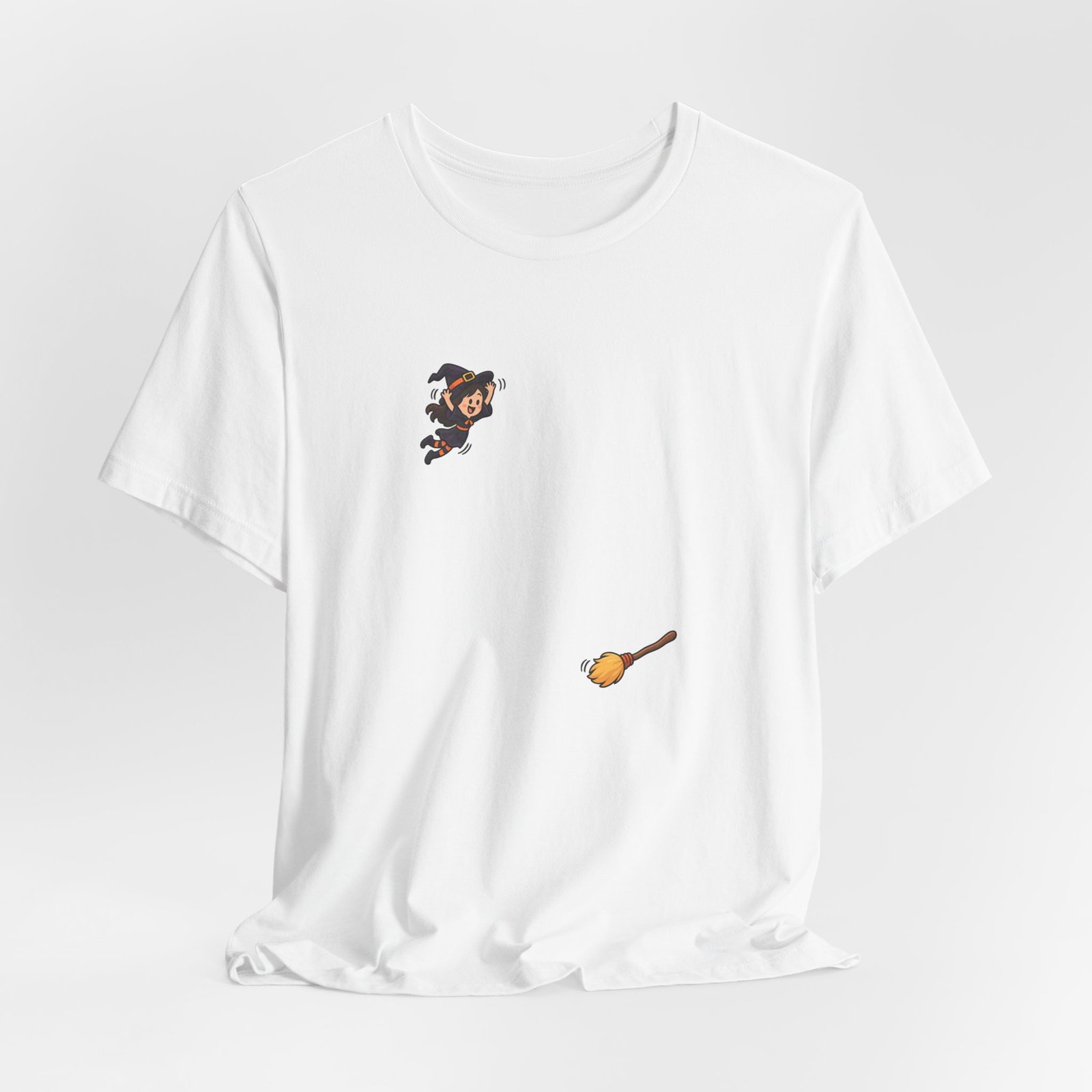 Playful Halloween Witch Jumping Onto Broom Graphic Tee - Image 4