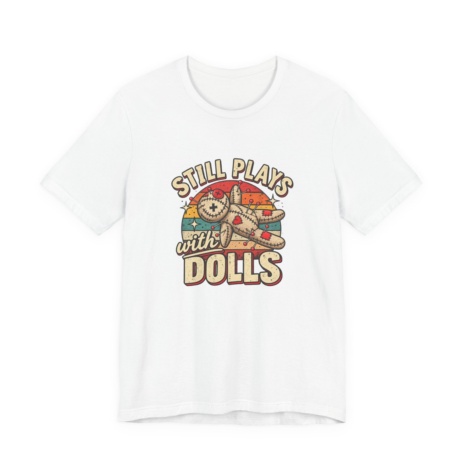 White t-shirt printed with a stitched voodoo doll pierced with pins in front of a retro sunburst, between the words Still plays with dolls
