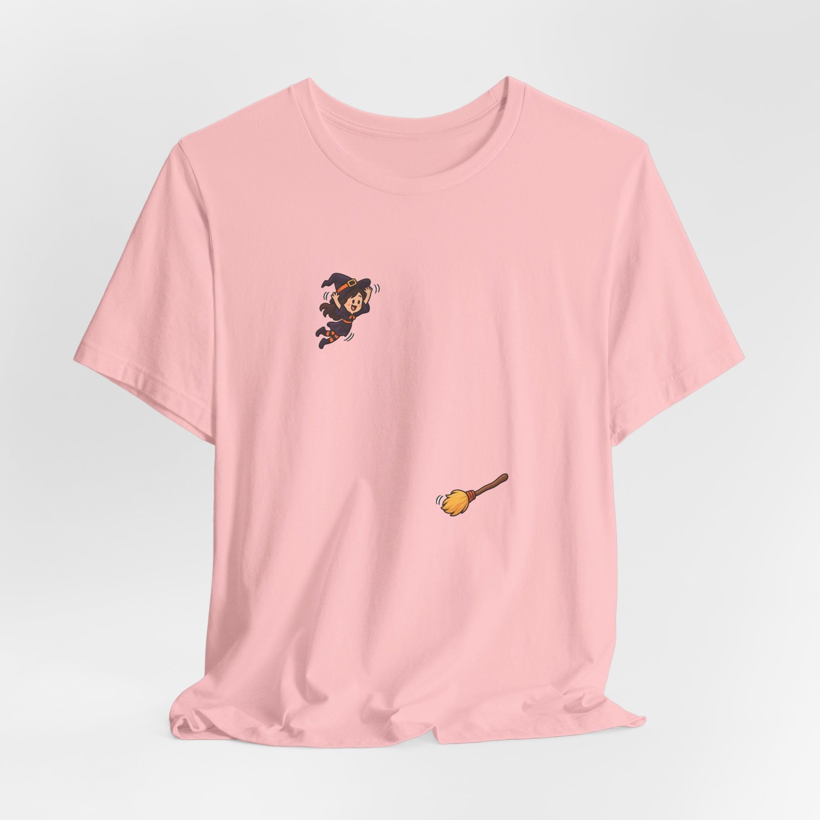 Playful Halloween Witch Jumping Onto Broom Graphic Tee - Image 16