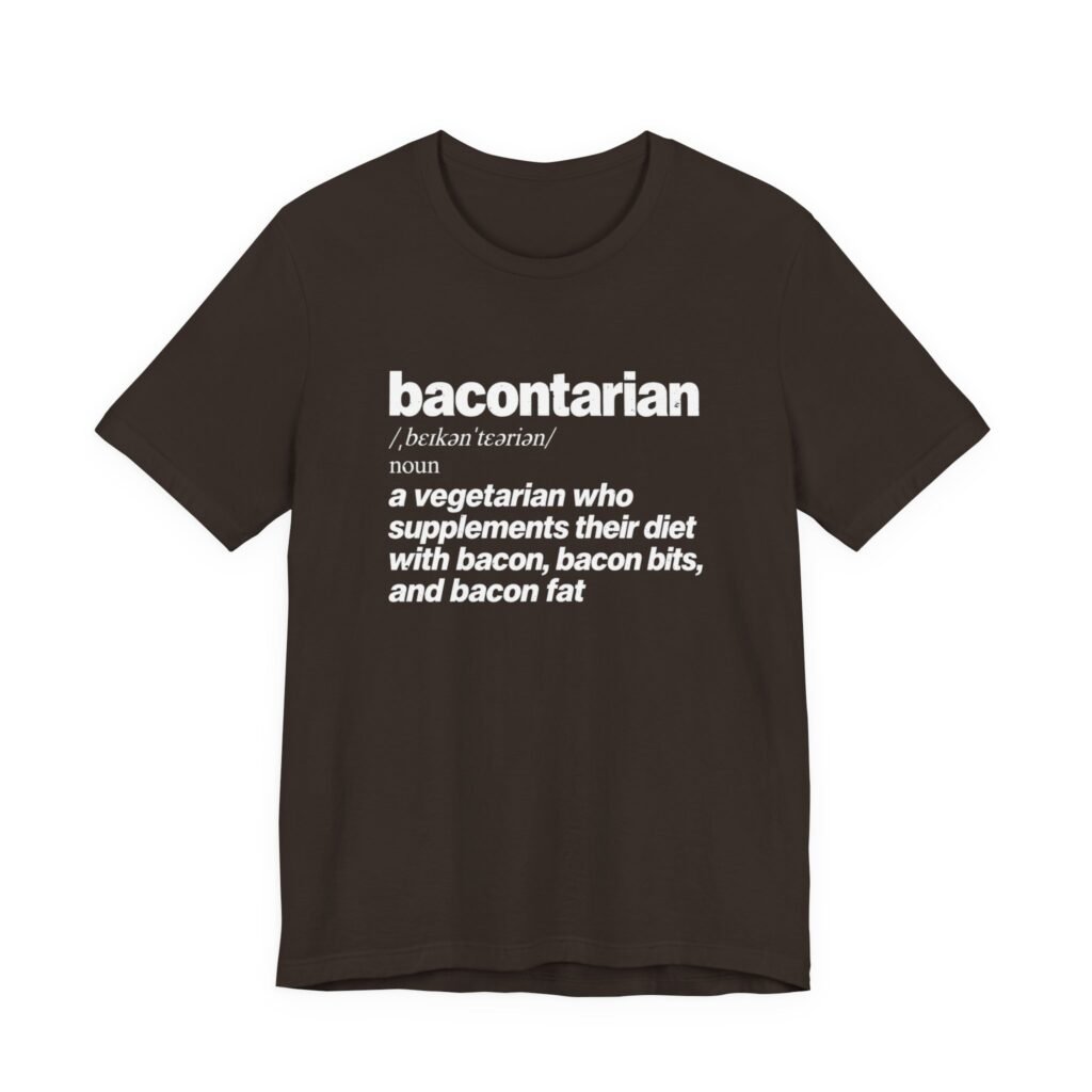 Dark brown t-shirt printed with a dictionary entry reading bacontarian, a vegetarian who supplements their diet with bacon