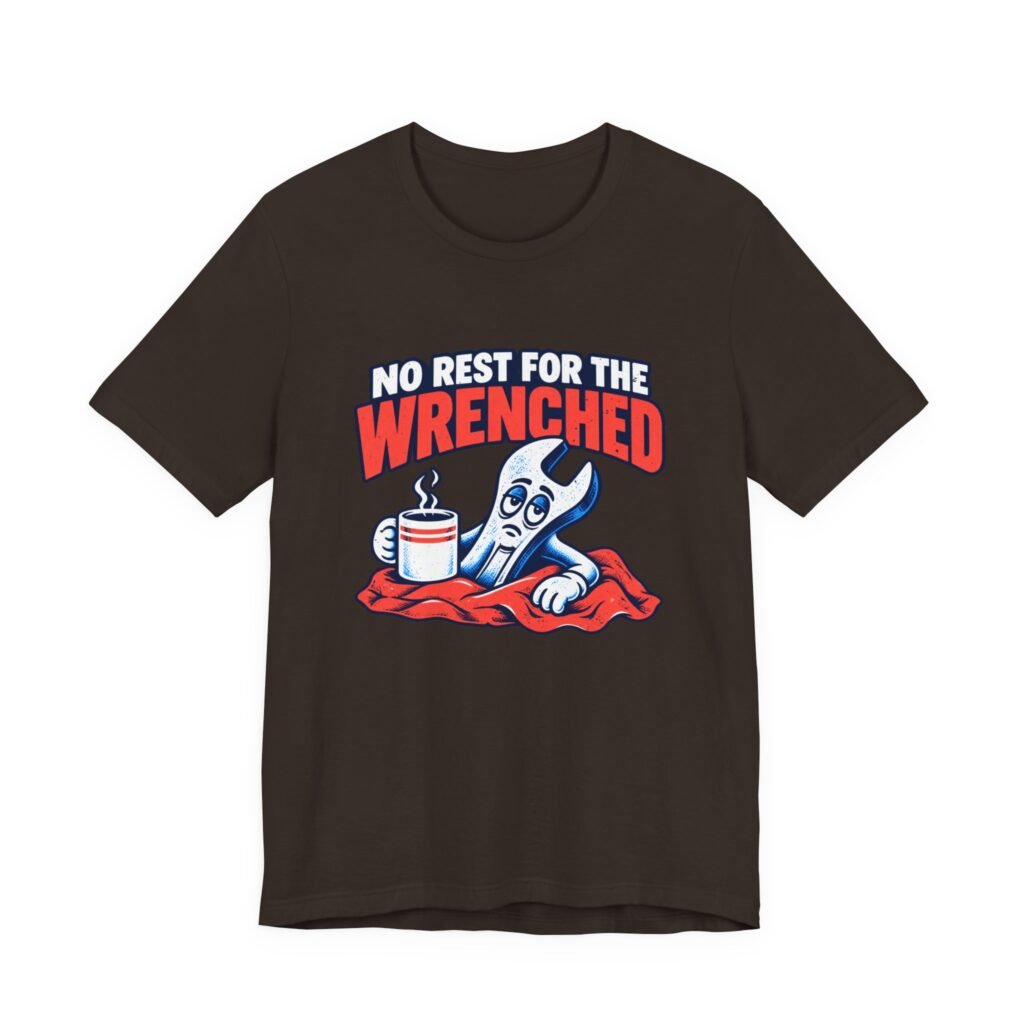 Dark brown t-shirt printed with a cartoon wrench in bed holding a coffee mug, between the words No rest for the wrenched